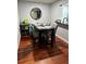 Stylish dining area with wood floors, black table, and comfortable chairs at 2035 Dixie Belle Dr # 2035C, Orlando, FL 32812