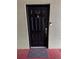 Close-up of a black front door with a keypad, doorbell, and peephole for added security at 2035 Dixie Belle Dr # 2035C, Orlando, FL 32812