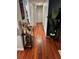 Stylish hallway featuring hardwood floors, elegant decor, and a statement wall enhancing the home's interior at 2035 Dixie Belle Dr # 2035C, Orlando, FL 32812