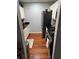 Galley kitchen with stainless steel appliances and hardwood flooring at 2035 Dixie Belle Dr # 2035C, Orlando, FL 32812