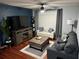 A cozy living room featuring hardwood floors, a ceiling fan, and comfortable seating arrangement at 2035 Dixie Belle Dr # 2035C, Orlando, FL 32812