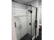 Contemporary walk-in shower with subway tile, black fixtures, and niche providing a spa-like experience at 2035 Dixie Belle Dr # 2035C, Orlando, FL 32812