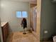 Bathroom featuring wood cabinets, a shower with tile surround, and a toilet at 2464 Lotafun Ave, Winter Park, FL 32789