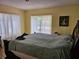 Bedroom with a large bed, natural light, and access to the yard at 2464 Lotafun Ave, Winter Park, FL 32789