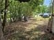 Landscaped front yard offering mature trees and greenery for natural shade at 2464 Lotafun Ave, Winter Park, FL 32789