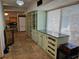 Hallway featuring tiled floor, and custom cabinets with plenty of storage at 2464 Lotafun Ave, Winter Park, FL 32789