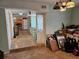 Hallway entrance featuring tiled floors with view to kitchen area at 2464 Lotafun Ave, Winter Park, FL 32789