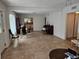 Spacious living room featuring tile floors and a view into the kitchen at 2464 Lotafun Ave, Winter Park, FL 32789