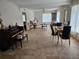 Large living room area with tile flooring, natural light, and neutral walls at 2464 Lotafun Ave, Winter Park, FL 32789