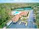 Community aerial showcasing the pool, clubhouse, tennis courts, and ample parking at 2770 Windsorgate Ln, Orlando, FL 32828