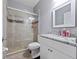 Modern bathroom featuring a glass-enclosed shower, granite countertop, and neutral color scheme creating a spa-like ambiance at 2770 Windsorgate Ln, Orlando, FL 32828