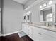 Bright bathroom featuring a double vanity with marble countertops, tile flooring, and modern fixtures at 2770 Windsorgate Ln, Orlando, FL 32828