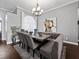 Cozy dining room featuring bench seating and a modern chandelier at 2770 Windsorgate Ln, Orlando, FL 32828