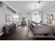Formal dining room with hardwood floors, a long table, and detailed trim at 2770 Windsorgate Ln, Orlando, FL 32828