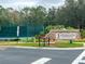 Fitness Center at Stoneybrook features a sign with stone accents and well-maintained landscaping, near a tennis court at 2770 Windsorgate Ln, Orlando, FL 32828