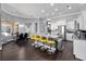 Modern kitchen with a central island, bar seating, and direct access to the dining area at 2770 Windsorgate Ln, Orlando, FL 32828