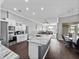 Spacious open concept kitchen with a large island, stainless steel appliances and white cabinetry at 2770 Windsorgate Ln, Orlando, FL 32828