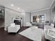 Bright living room features a stone accent wall with fireplace and view of the backyard at 2770 Windsorgate Ln, Orlando, FL 32828