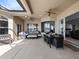 Inviting outdoor patio with ample seating and a dining area, offering a comfortable space for relaxation and entertaining at 2770 Windsorgate Ln, Orlando, FL 32828
