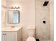 Modern bathroom with sleek vanity, updated fixtures, toilet, and a stylish tiled shower at 3028 Parkway Blvd # 105, Kissimmee, FL 34747