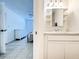 Bathroom with an undermount sink with framed mirror and built-in shelves at 3028 Parkway Blvd # 105, Kissimmee, FL 34747