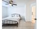 Tiled bedroom featuring an ensuite bathroom and large window at 3028 Parkway Blvd # 105, Kissimmee, FL 34747