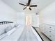 Bright bedroom featuring a ceiling fan, tiled floor, and neutral decor at 3028 Parkway Blvd # 105, Kissimmee, FL 34747