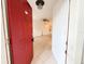 Welcoming entryway showcasing a red front door, tile flooring, and views into the bright living space at 3028 Parkway Blvd # 105, Kissimmee, FL 34747