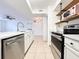 Contemporary kitchen boasts stainless steel appliances, stylish countertops, and open layout at 3028 Parkway Blvd # 105, Kissimmee, FL 34747