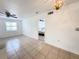 Open floor plan with tile flooring connecting the living area to the bedroom at 3028 Parkway Blvd # 105, Kissimmee, FL 34747