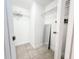 A spacious walk-in closet featuring tiled floors, wire shelving, and a full-length mirror for convenience at 3028 Parkway Blvd # 105, Kissimmee, FL 34747