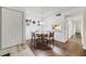 Inviting dining space with a table for four, adjacent to the kitchen, featuring hardwood floors, and recessed lighting at 3294 S Semoran Blvd # 14, Orlando, FL 32822
