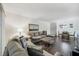 Open living and dining area with hardwood floors, neutral walls, a dining table for four, and a bright atmosphere at 3294 S Semoran Blvd # 14, Orlando, FL 32822