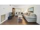 Bright living room with hardwood floors, comfortable seating, natural light from large windows, and tasteful decor at 3294 S Semoran Blvd # 14, Orlando, FL 32822