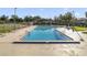 Sparkling community pool with clear blue water and ample deck space for lounging and recreation on a sunny day at 3294 S Semoran Blvd # 14, Orlando, FL 32822