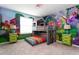 The bedroom features a bunk bed with a house-shaped frame and colorful cartoon mural on the walls at 3413 Lilac, Davenport, FL 33897