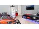The bedroom features two race car beds, gas pump decor and an entertainment center at 3413 Lilac, Davenport, FL 33897