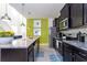 Spacious kitchen featuring granite countertops, stainless steel appliances, and dark wood cabinetry at 3413 Lilac, Davenport, FL 33897