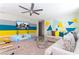 A spacious living room with vibrant accent colors, modern decor, and a large-screen TV at 3413 Lilac, Davenport, FL 33897