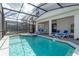 Beautiful backyard with a sparkling pool, jacuzzi, and lounge chairs, perfect for relaxation at 3413 Lilac, Davenport, FL 33897