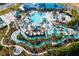 Aerial view of a community waterpark featuring pools, slides, and various water attractions at 3413 Lilac, Davenport, FL 33897
