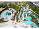 Aerial view of a resort waterpark with lazy river, waterslides, splash pad and miniature golf for Gathering fun at 3413 Lilac, Davenport, FL 33897