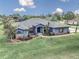 Lovely single-story home with lush lawn, mature landscaping, and a long driveway at 4037 Se 40Th St, Ocala, FL 34480