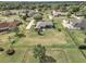 Aerial view of a home featuring an expansive backyard and mature trees in a residential neighborhood at 4037 Se 40Th St, Ocala, FL 34480