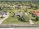 Aerial view captures a home with a spacious lawn, mature trees, and a neighborhood setting at 4037 Se 40Th St, Ocala, FL 34480