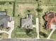 Aerial view showcases a home with a large yard, driveway, and established landscaping at 4037 Se 40Th St, Ocala, FL 34480