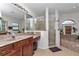 Bathroom featuring double sinks, large tub, and glass enclosed shower at 4037 Se 40Th St, Ocala, FL 34480
