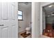 Bathroom featuring a window, toilet and hardwood floor at 4037 Se 40Th St, Ocala, FL 34480
