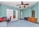 Bedroom with cherry wood flooring, ceiling fan, closet, and view to additional room at 4037 Se 40Th St, Ocala, FL 34480