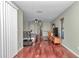 Bedroom featuring hardwood floors, light green painted walls, ceiling fan, and ample natural light at 4037 Se 40Th St, Ocala, FL 34480